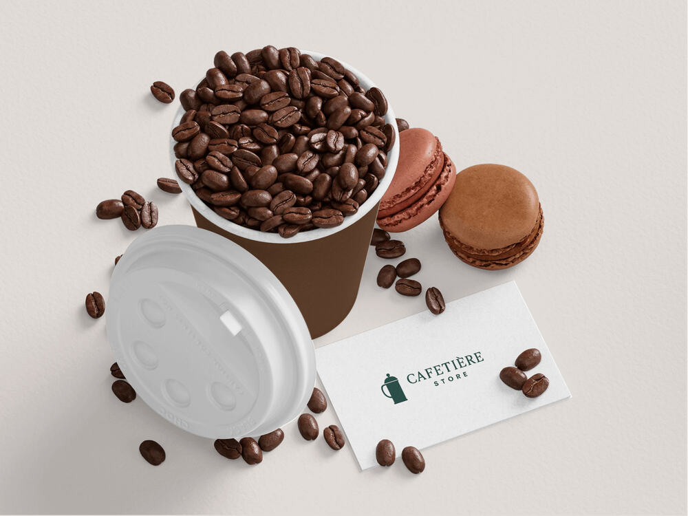 Coffee beans with macarons and card